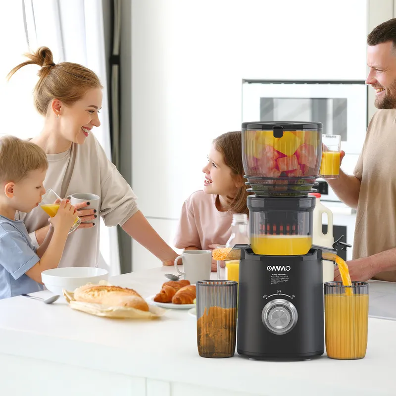 A family is uising juicer to make juice A family is uising juicer to make juices and vegetable juices.