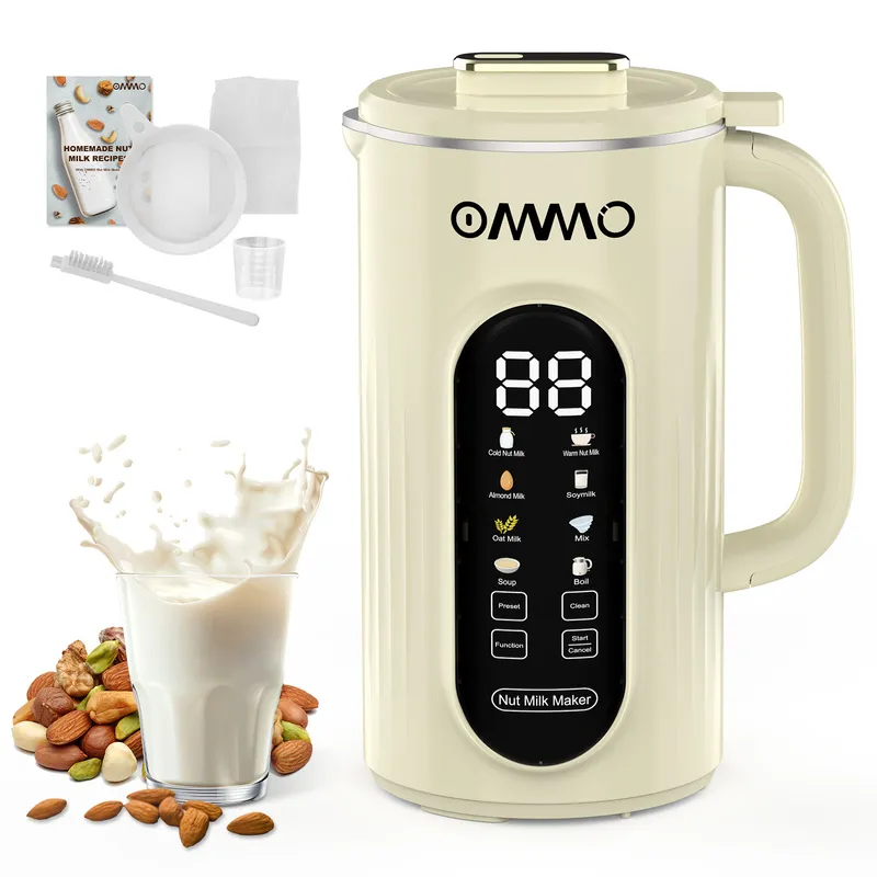 A white nut milk maker Mmchine with a cup of milk nearby.