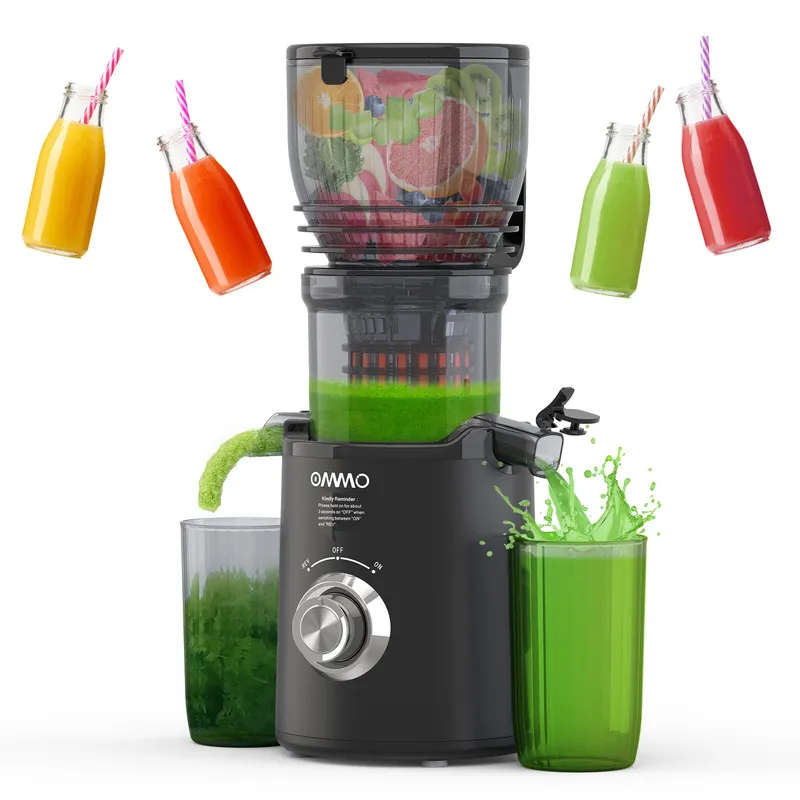 A large black cold press juicer is working for a green juice.